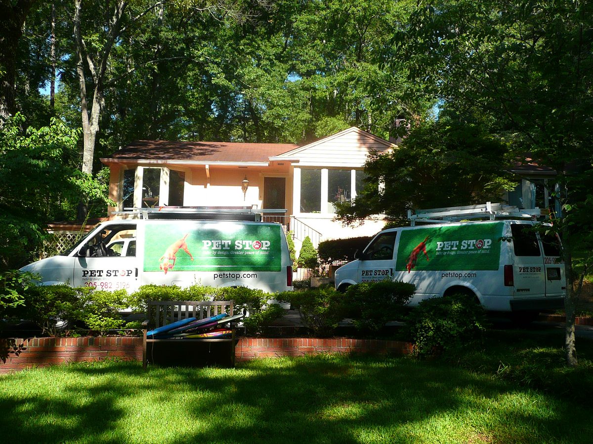 Two Pet Stop of Alabama service vans parked at a Birmingham area home
