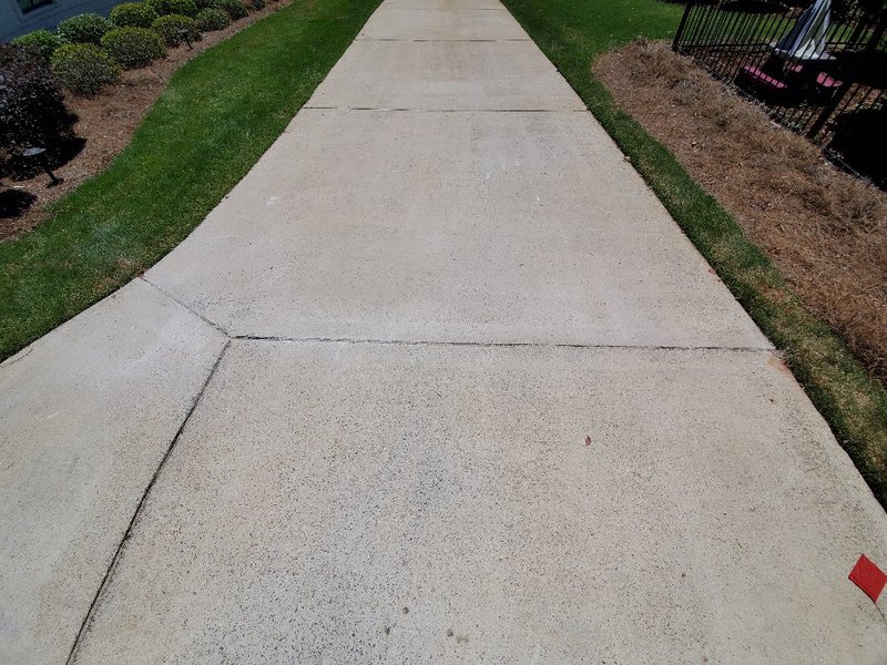 Driveway expansion joint used to run boundary wire across a driveway crossing