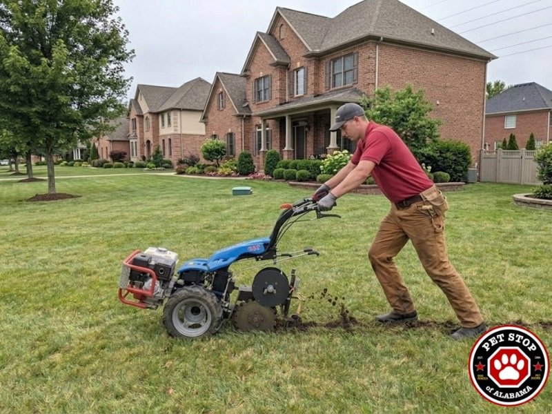 Installer trenching boundary wire into a residential yard