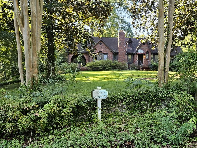 Historic brick home and shaded front lawn in a Birmingham historic district