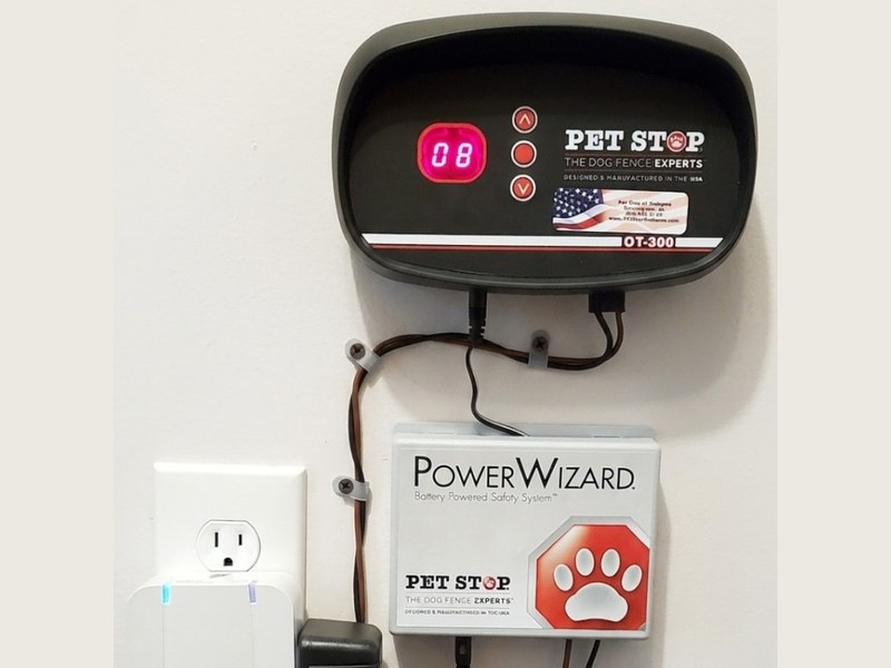 Pet Stop transmitter mounted on a wall with battery backup and surge protection